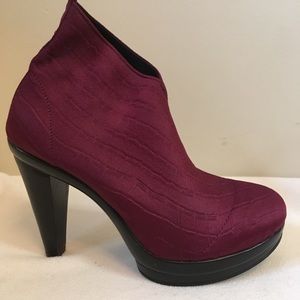 Burgundy, elastic sock boots.